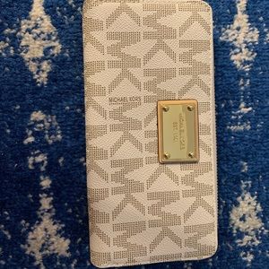 Gently used Michael Kors zip wallet